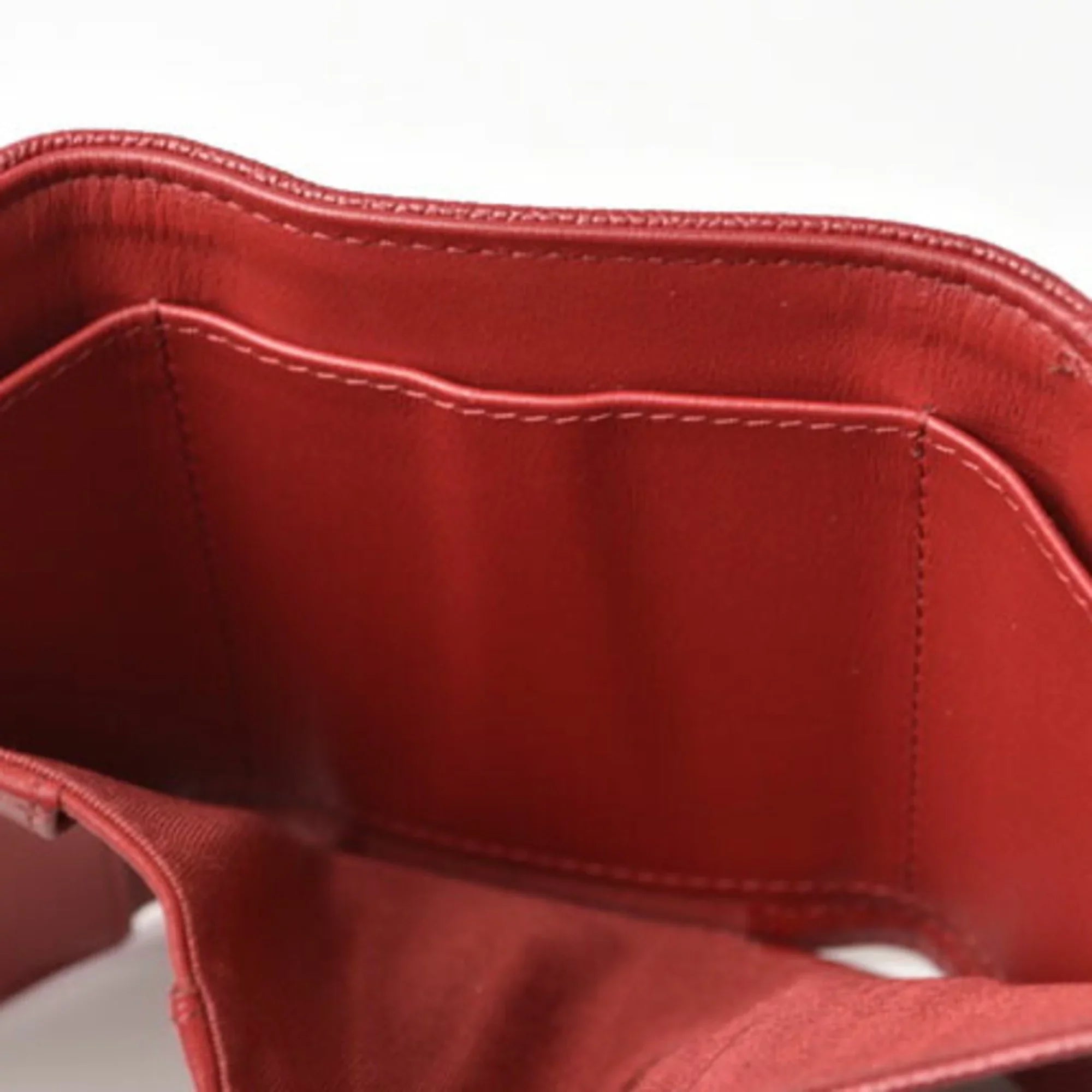 Pre-Owned Chanel wallet  here mark caviar skin dark red (Like New)
