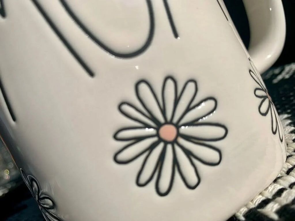 Rae Dunn  Ivory Ceramic Mug Black  Letters Black Daisys 16 oz dishwasher safe may get hot in Microwave Mother's Day