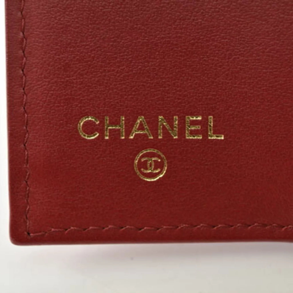 Pre-Owned Chanel wallet  here mark caviar skin dark red (Like New)