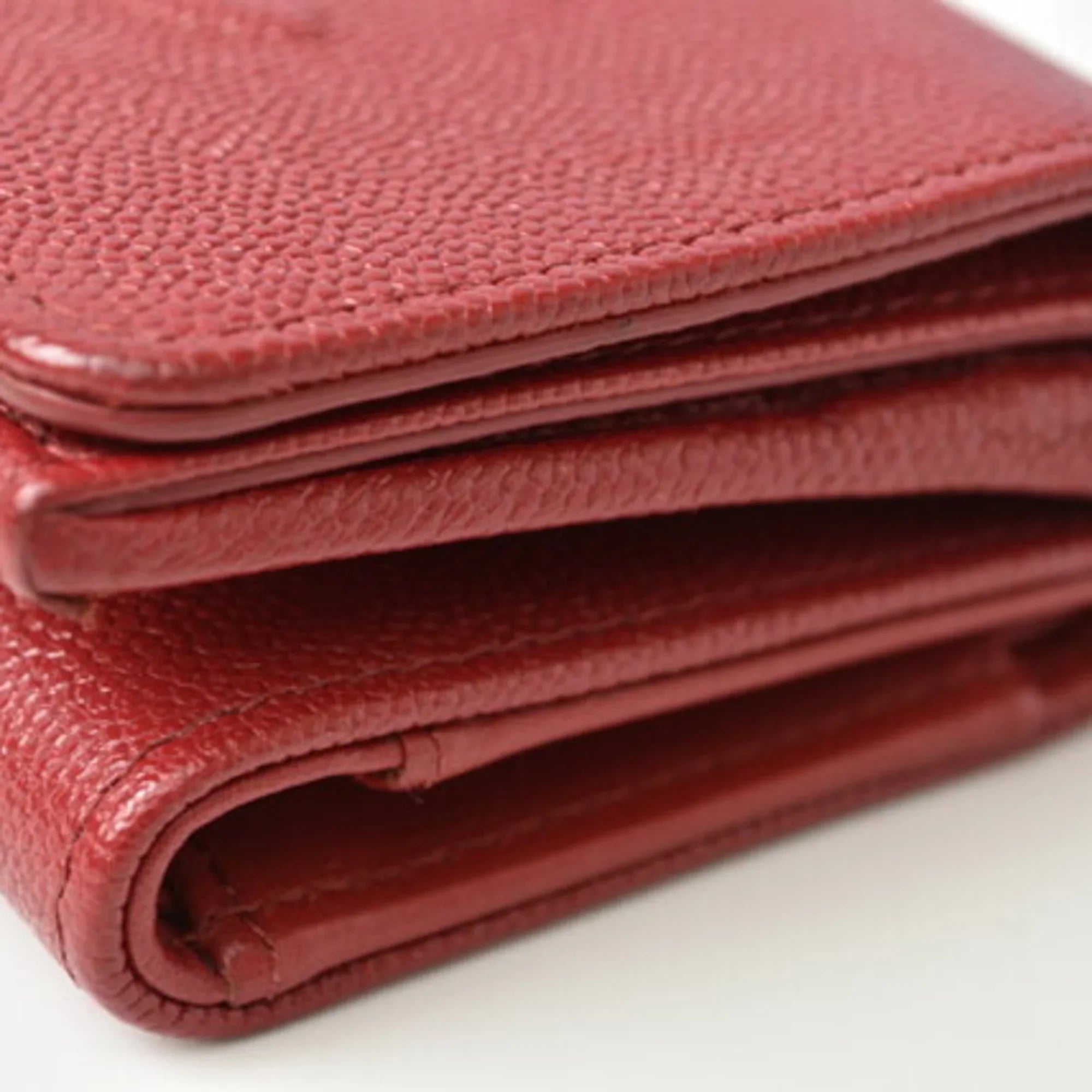 Pre-Owned Chanel wallet  here mark caviar skin dark red (Like New)